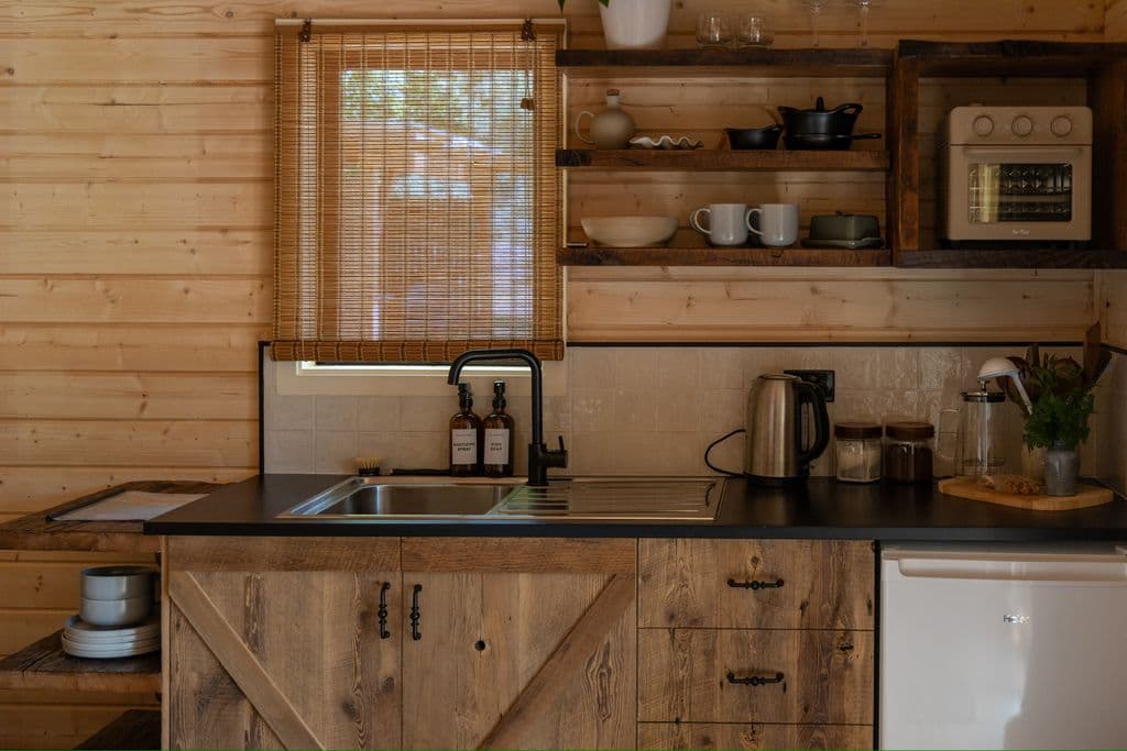 Rustic Hawke’s Bay farmstay accommodation in handmade timber cottage with kitchenette