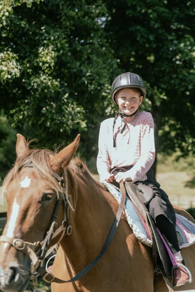 Young girl enjoying a horse trek at Mohaka River Farm near Napier