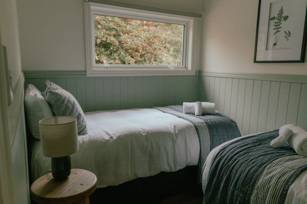 Two bedroom farmstay cottage in Hawke’s Bay sleeping 4 with full kitchen and fireplace