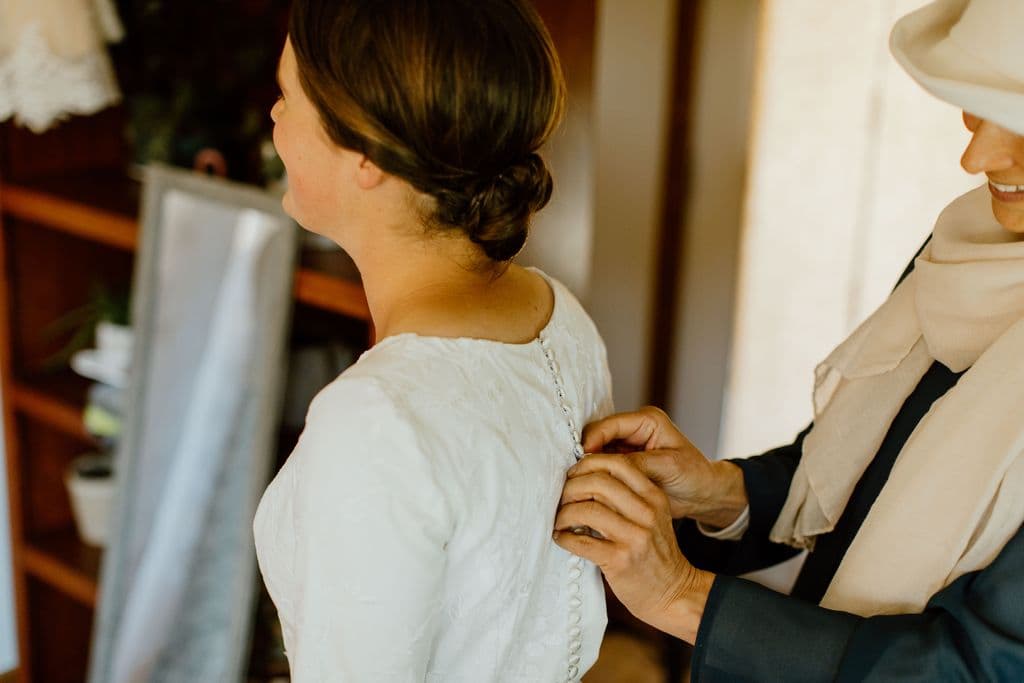 Mother and daughter sharing an emotional moment in the bridal room before the wedding ceremony.