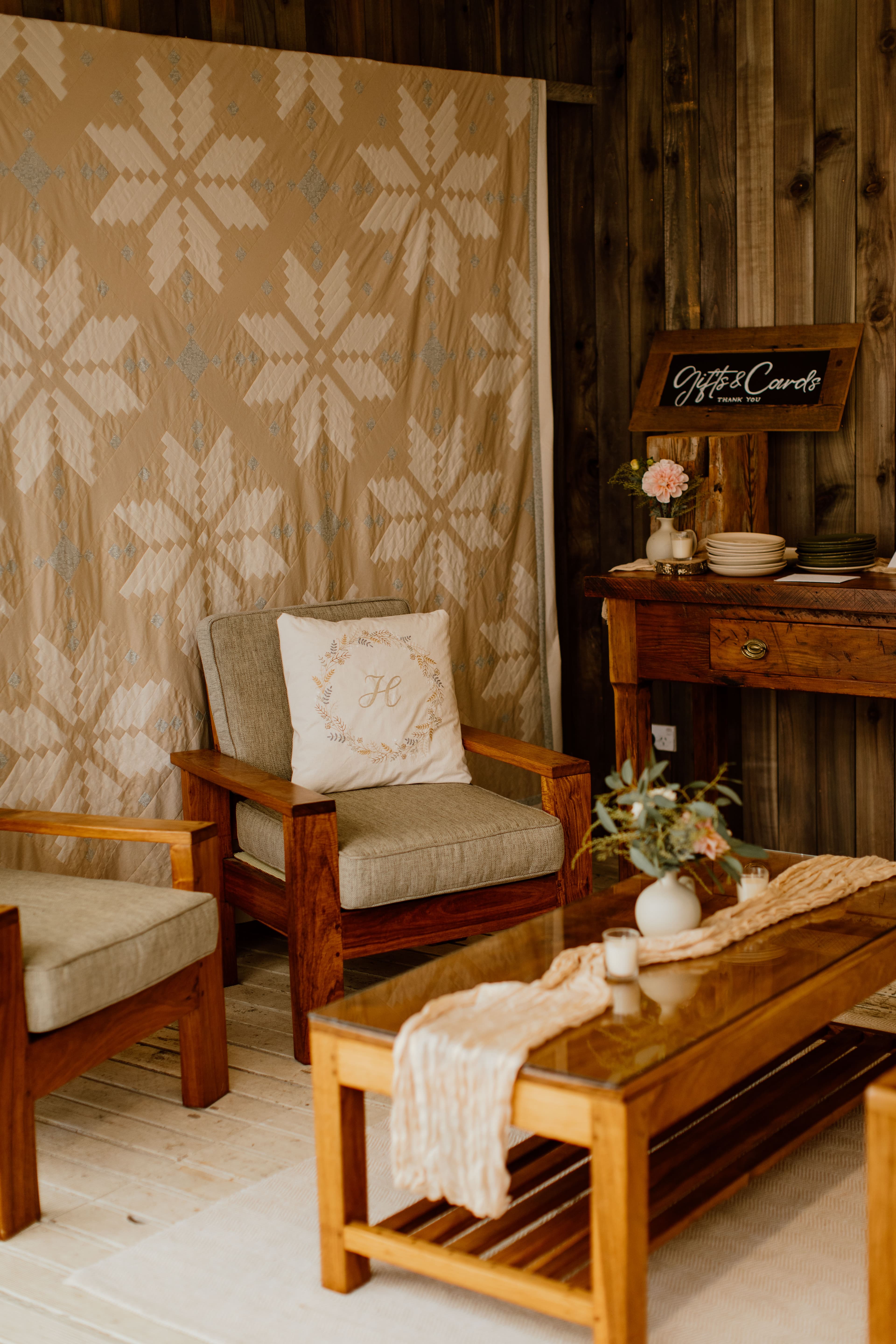 Family heirlooms including wedding quilts and handcrafted timber furniture in cozy setting
