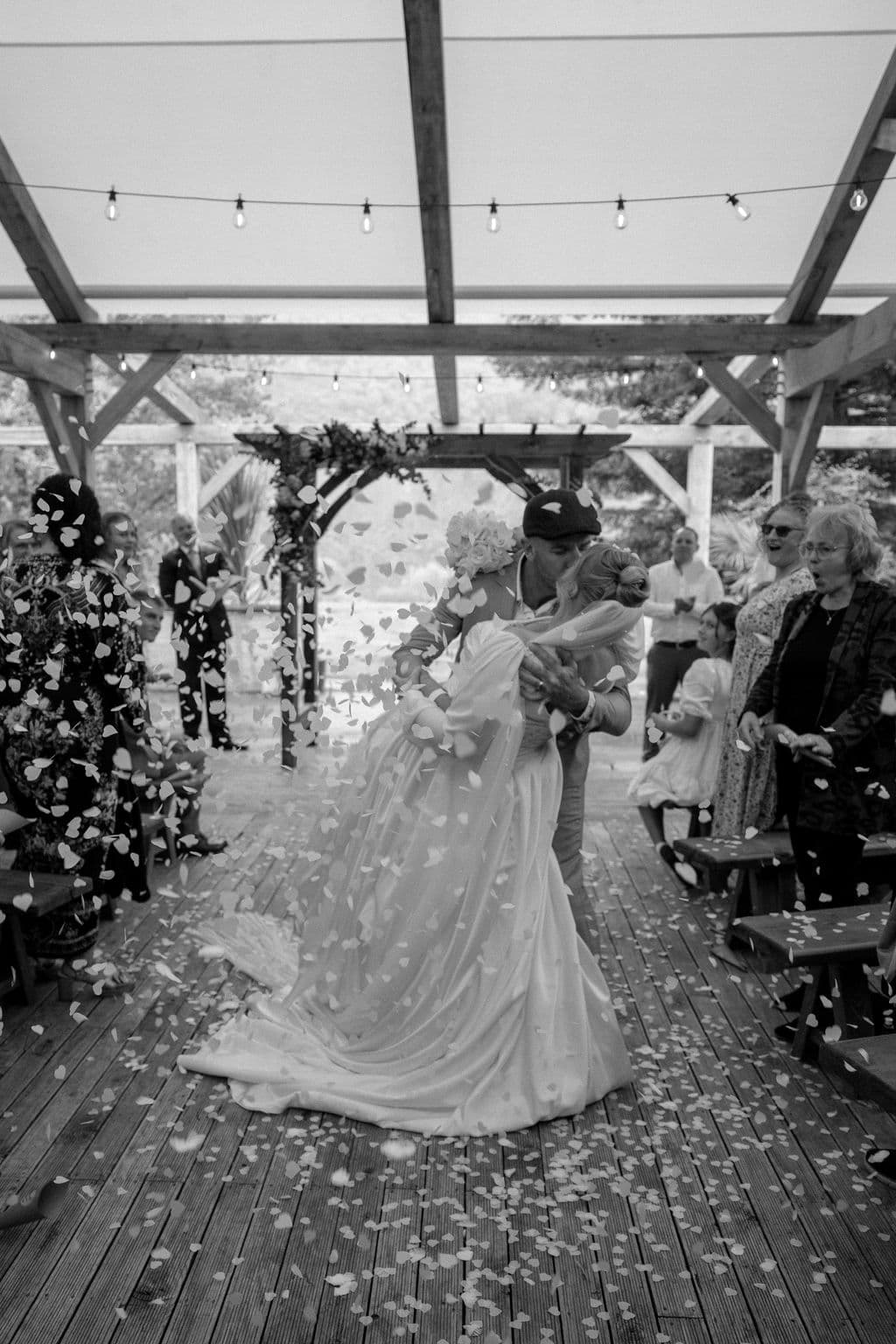 Bride and groom kissing during their first dance together as husband and wife. Wedding held at Mohaka River Farm in Hawke's Bay, 2026