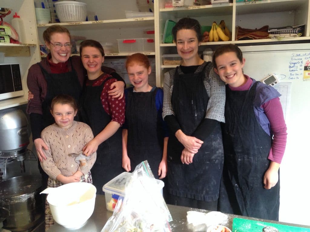 Christian community of former urban residents working and spending time together on a rural property, creating a peaceful environment for their families.